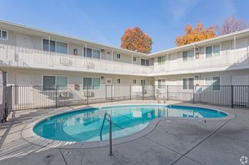 A small pool in the courtyard of apartment buildings.